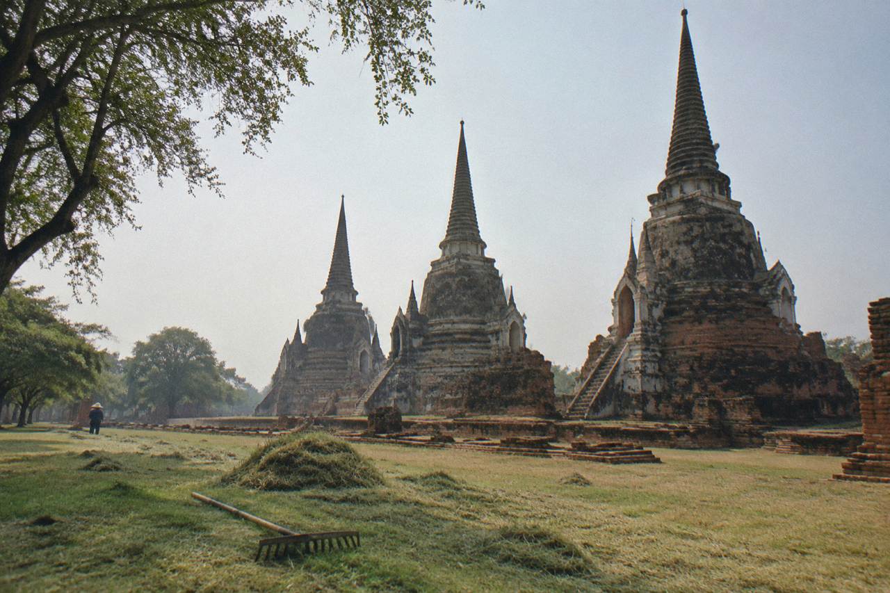 Bicycles parked beside ancient brick temple ruins under a wide sky