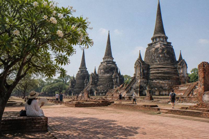 Guided day trip from Bangkok to Ayutthaya showing ancient temple ruins visited on a group tour of the historical park